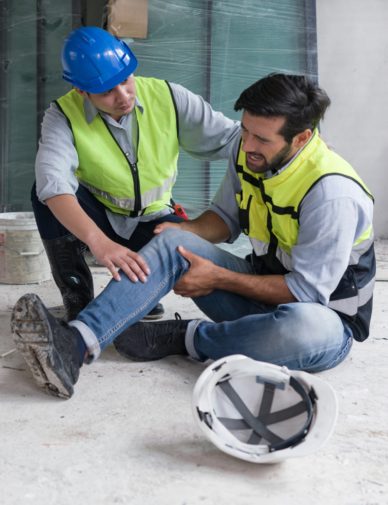 First Aider administering care to injured worker.
